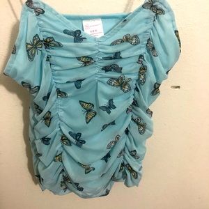 Blue tank top with butterfly design
